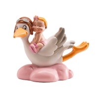 Figura para tarta de bautizo de cigüeña volando con bebé rosa - 9 cm