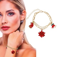 Pulsera de gorro, campana y flor de Navidad dorada - 1 unidad